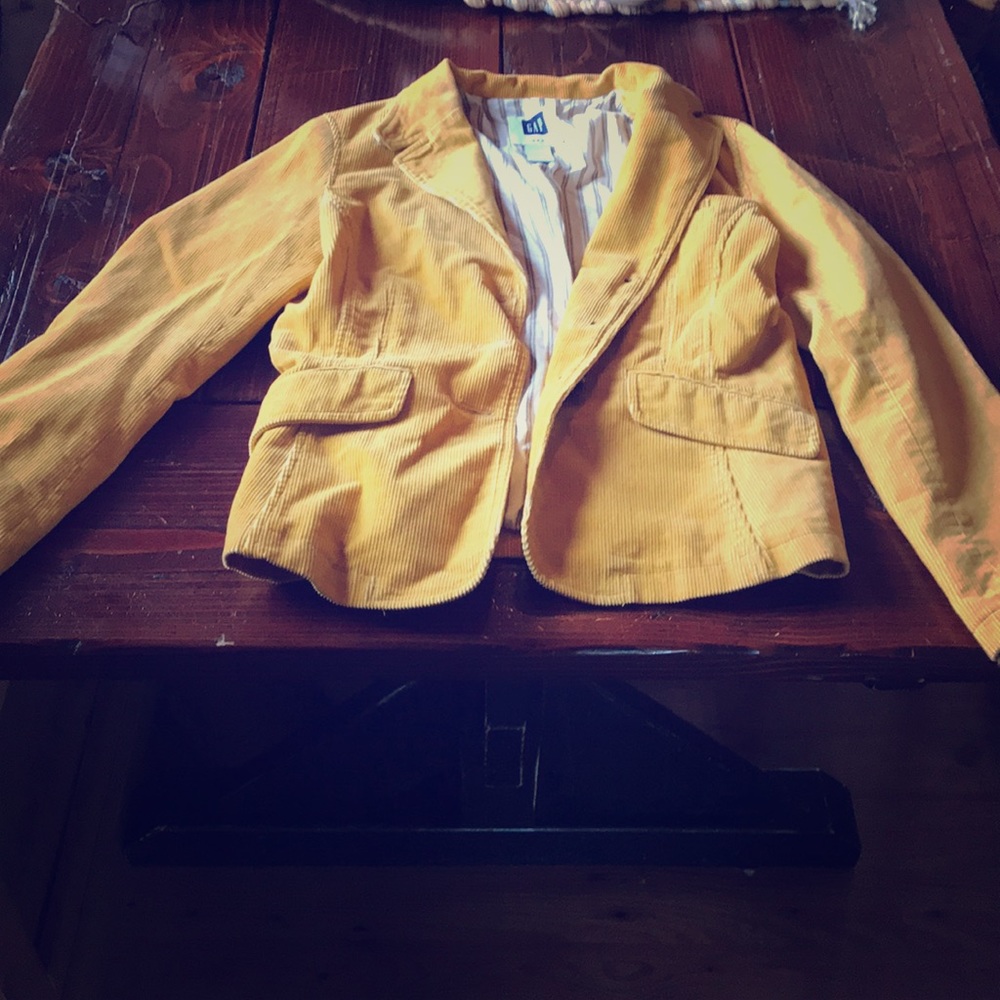 Gold colored corduroy blazer.